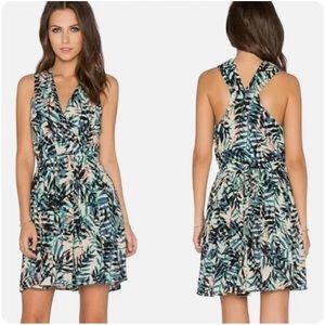 Flowy dress with palm/tropical pattern, hits above the knee